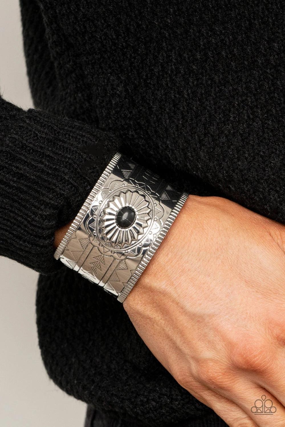 Paparazzi Accessories Aztec Artisan - Black Dotted with a black stone center, a thick silver cuff is etched, stamped, and embossed in geometric tribal inspired textures for a seasonal look. Jewelry