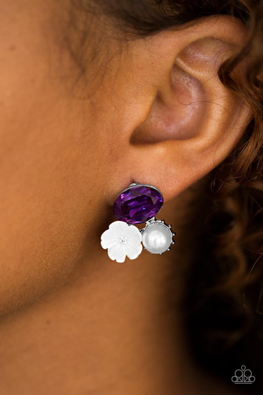 Paparazzi Accessories Lily Lagoon - Purple A glittery purple rhinestone, a pearly white bead, and shimmery white flower coalesce into a whimsical frame. Earring attaches to a standard post fitting. Jewelry