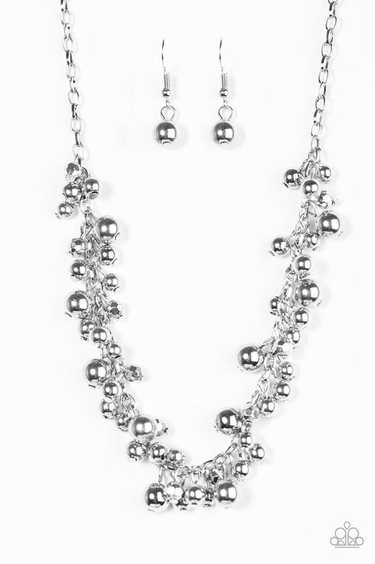 Paparazzi Accessories Belle of the Ball - Silver Varying in size and shimmer, classic and faceted silver beads trickle from the bottom of a shimmery silver chain, creating a bold fringe below the collar. Features an adjustable clasp closure. Sold as one i