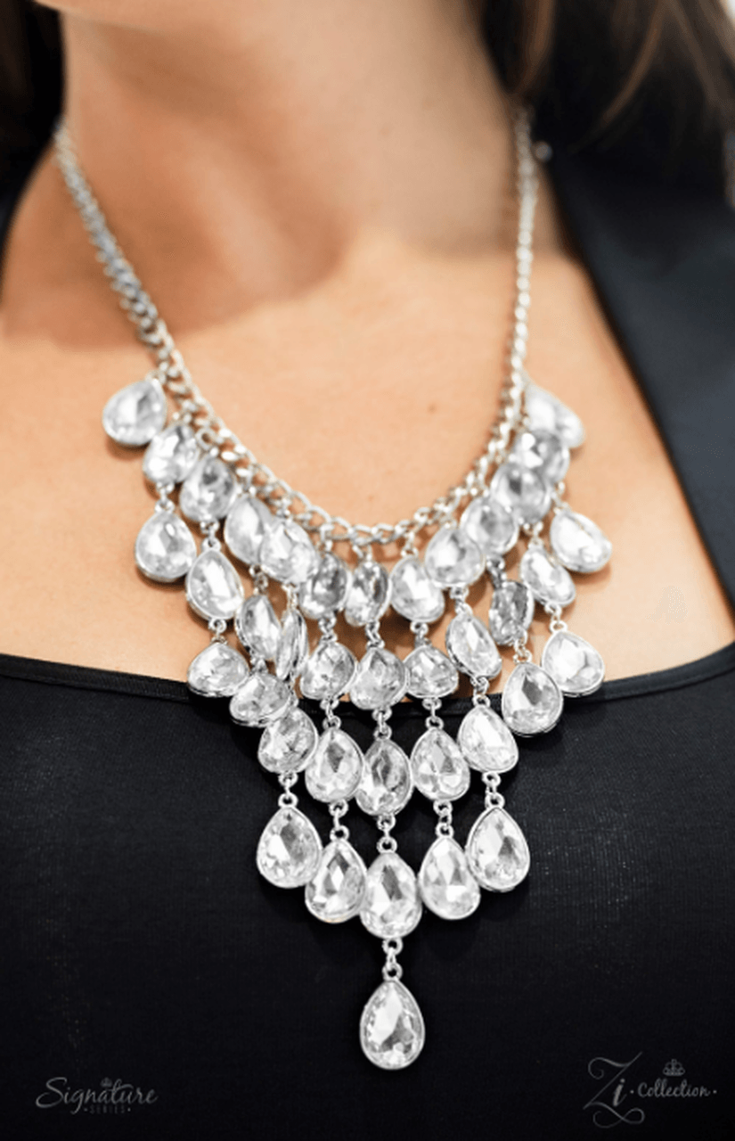 Paparazzi Accessories The Shanae Glittery white gems are pressed into silver teardrop frames, creating a gorgeous tapered fringe below the collar as the sparkling drops link together in vertical rows of blinding shimmer. Features an adjustable clasp closu