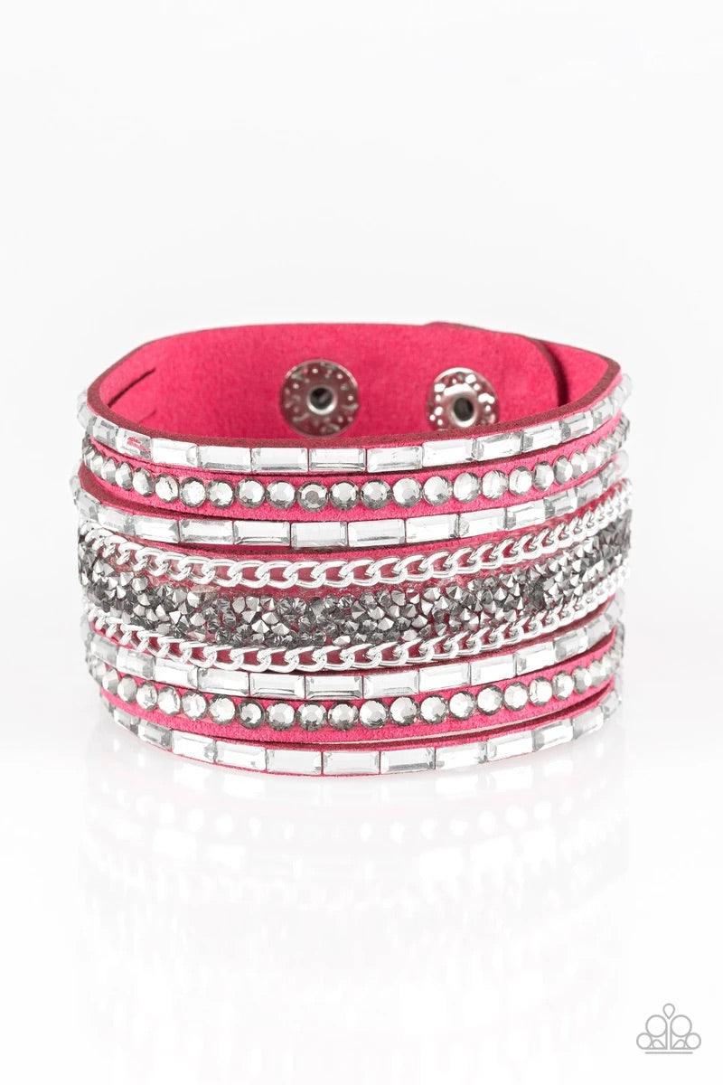 Paparazzi Accessories Rhinestone Rumble - Pink White emerald-cut rhinestones, smoky round rhinestones, and metallic prism-shaped rhinestones are sprinkled along strands of vivacious pink suede. Shimmery silver chain is added to the mix for a sassy industr