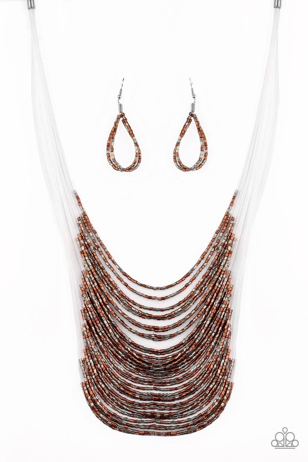 Paparazzi Accessories Catwalk Queen - Multi Strand after strand of metallic copper and gunmetal seed beads fall together to create a bold statement piece. Features an adjustable clasp closure. Sold as one individual necklace. Includes one pair of matching