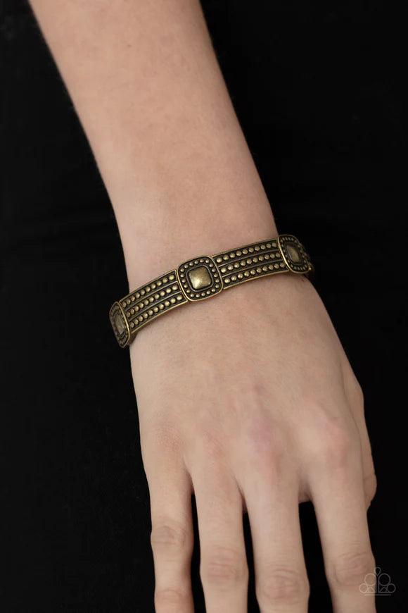 Paparazzi Accessories Rustic Redux - Brass Featuring brass studded patterns, square and rectangular frames are threaded along stretchy bands around the wrist for a rustic flair. Sold as one individual bracelet. Bracelets