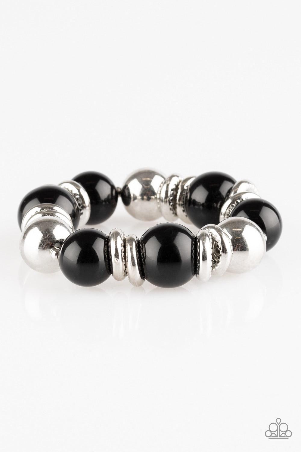 Paparazzi Accessories Rockin Rockefeller ~Black Dramatic black beads and shiny silver beads are threaded along an elastic stretchy band around the wrist. Glistening silver accents are sprinkled between the classic beads, adding depth and shimmer to the bu