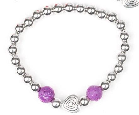 Paparazzi Accessories Starlet Shimmer Bracelet #13 - Purple Featuring silver heart charms, with a glassy colored bead. Jewelry