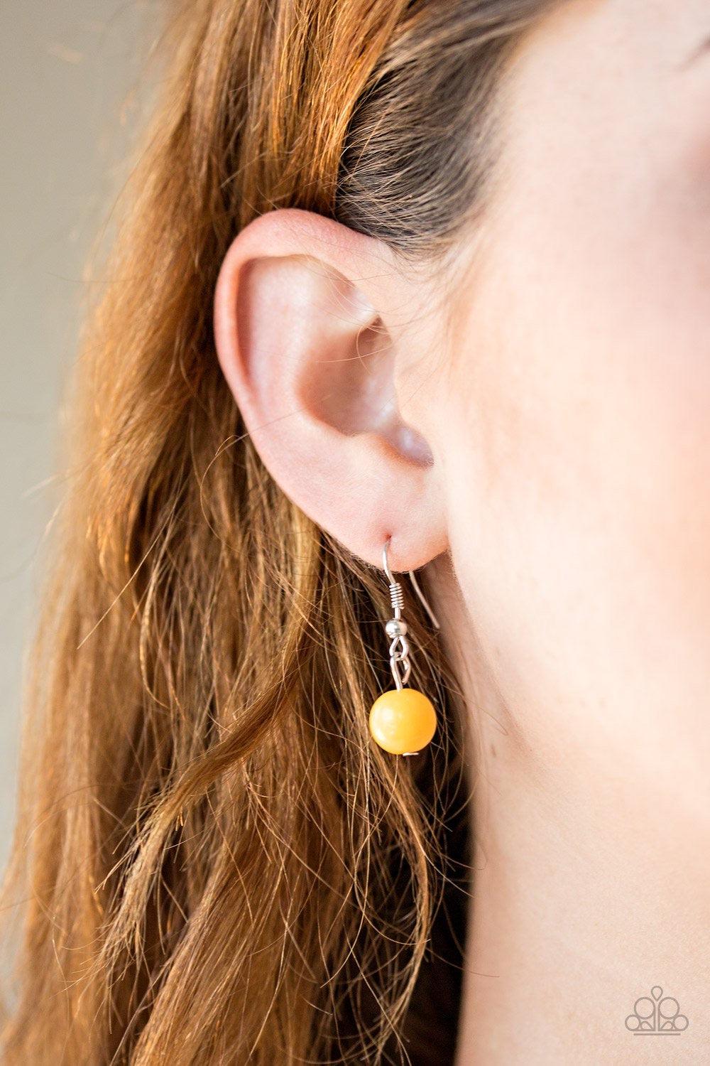 Paparazzi Accessories Beachside Babe - Yellow Featuring hearty yellow beads and shimmery silver hoops, mismatched silver chains layer down the chest for a seasonal look. Features an adjustable clasp closure. Jewelry