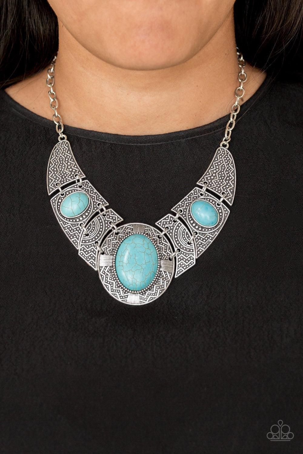 Paparazzi Accessories Leave Your LANDMARK - Blue Radiating with studded and tribal inspired patterns, antiqued silver plates connect below the collar for a fierce look. Refreshing turquoise stones are pressed into the plates, adding an artisan flair to th
