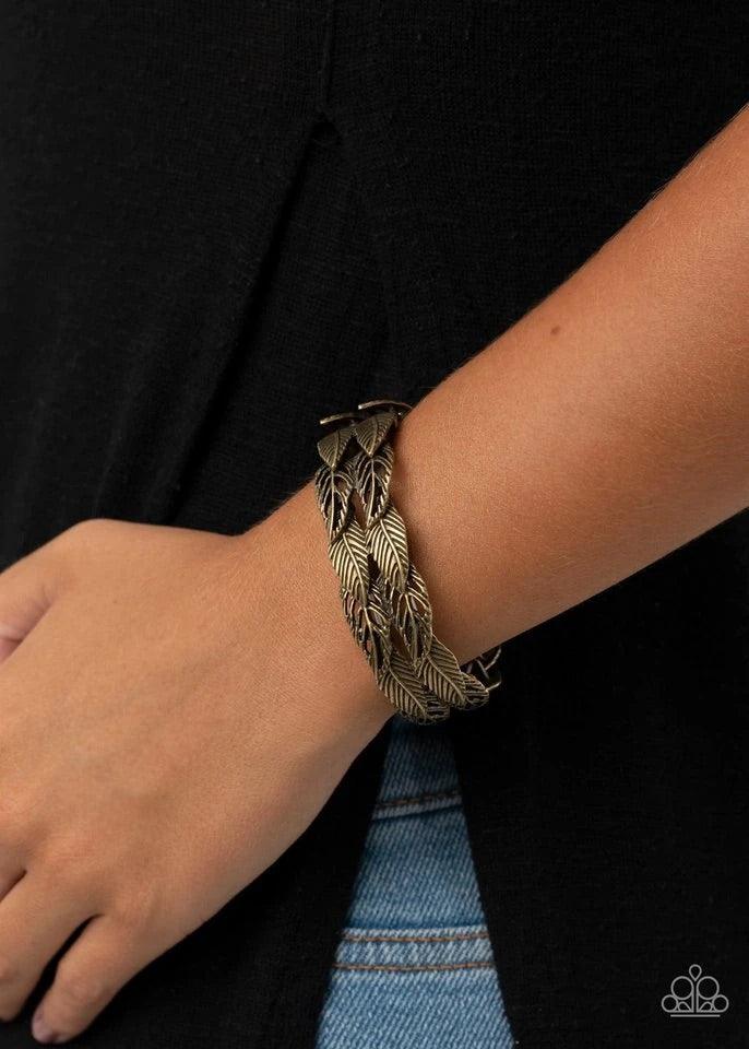 Paparazzi Accessories It’s Five o’FLOCK Somewhere - Brass Featuring life-like textures, pairs of brass feather charms are threaded along stretchy bands as they overlap around the wrist for a whimsical look. Jewelry