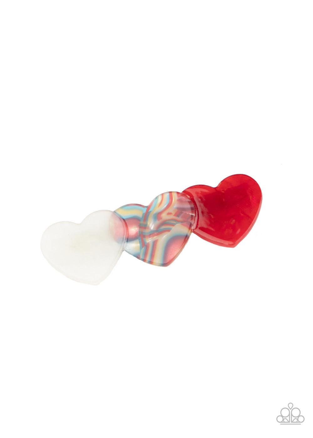 Paparazzi Accessories Doesn’t HEART To Ask - Multi Featuring polished and shell-like finishes, a trio of white, multicolored, and red heart-shaped acrylic frames delicately overlap into a charming frame. Features a standard hair clip on the back. Sold as