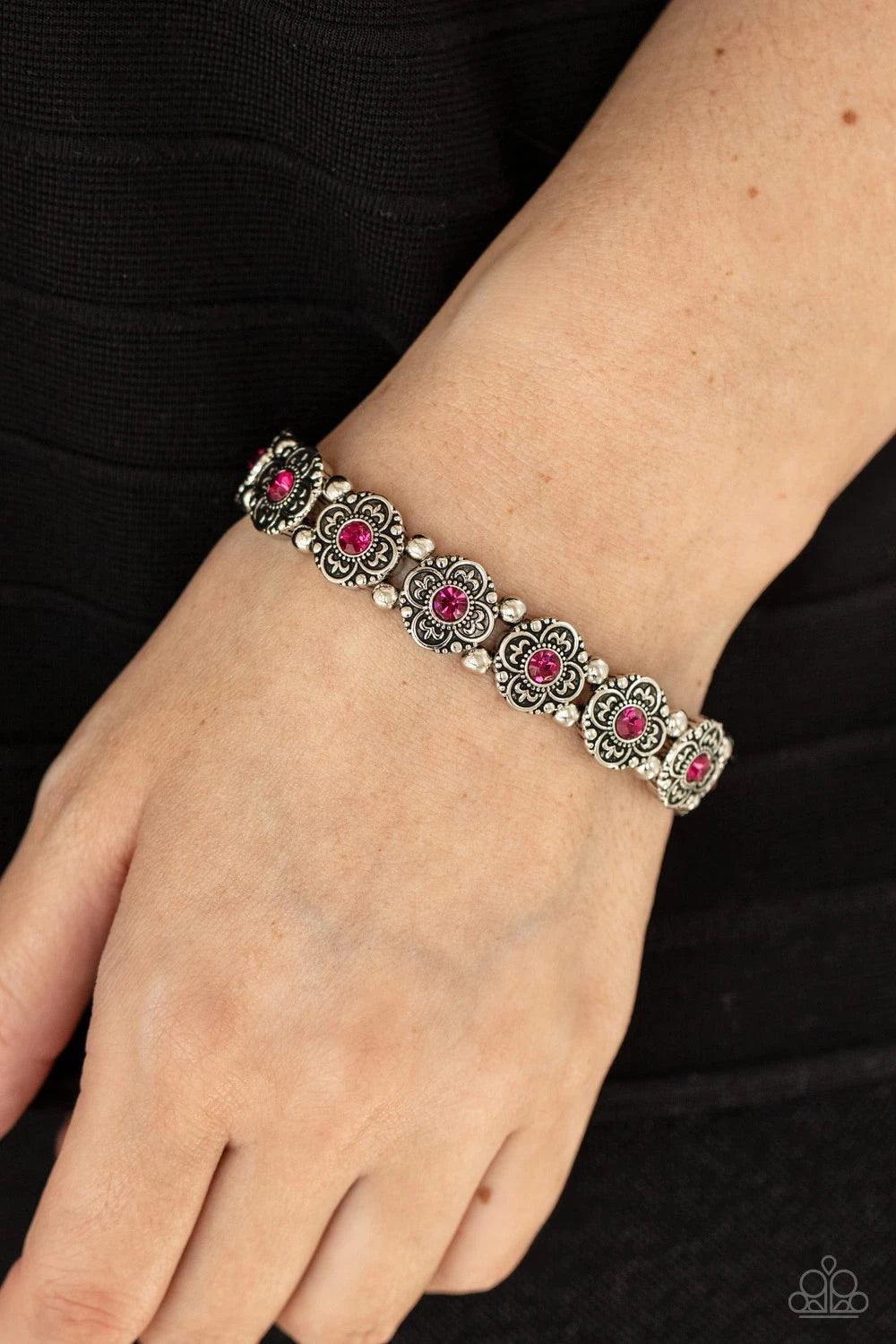 Paparazzi Accessories Tres Magnifique ~Pink Dotted with glittery pink rhinestone centers, antiqued silver floral frames and dainty silver beads are threaded along stretchy bands around the wrist for a seasonal twist. Sold as one individual bracelet. Jewel