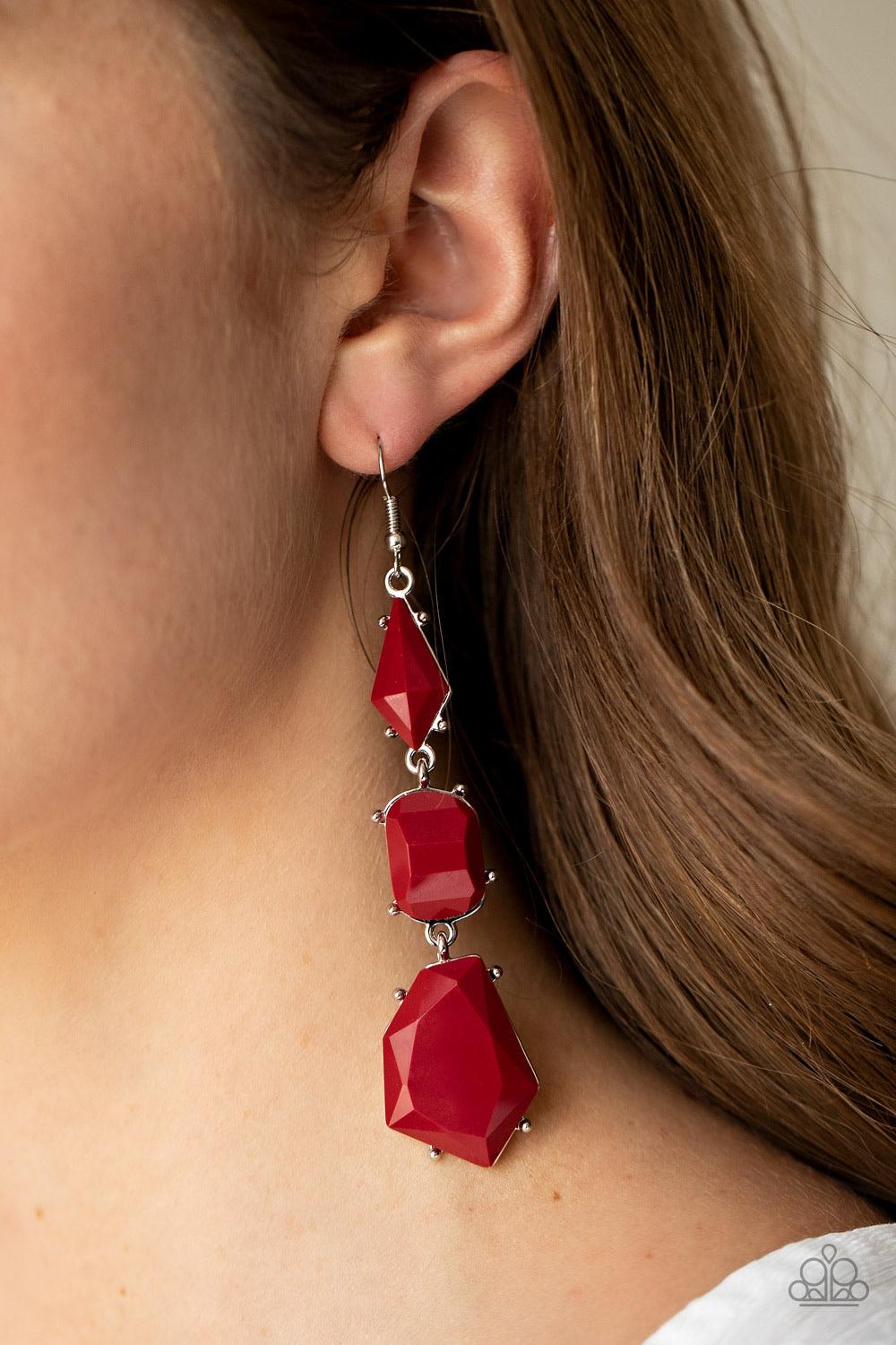 Paparazzi Accessories Geo Getaway - Red Varying in shape, imperfectly faceted Samba beads are encased in studded silver frames as they delicately link into a colorful lure. Earring attaches to a standard fishhook fitting. Sold as one pair of earrings. Jew