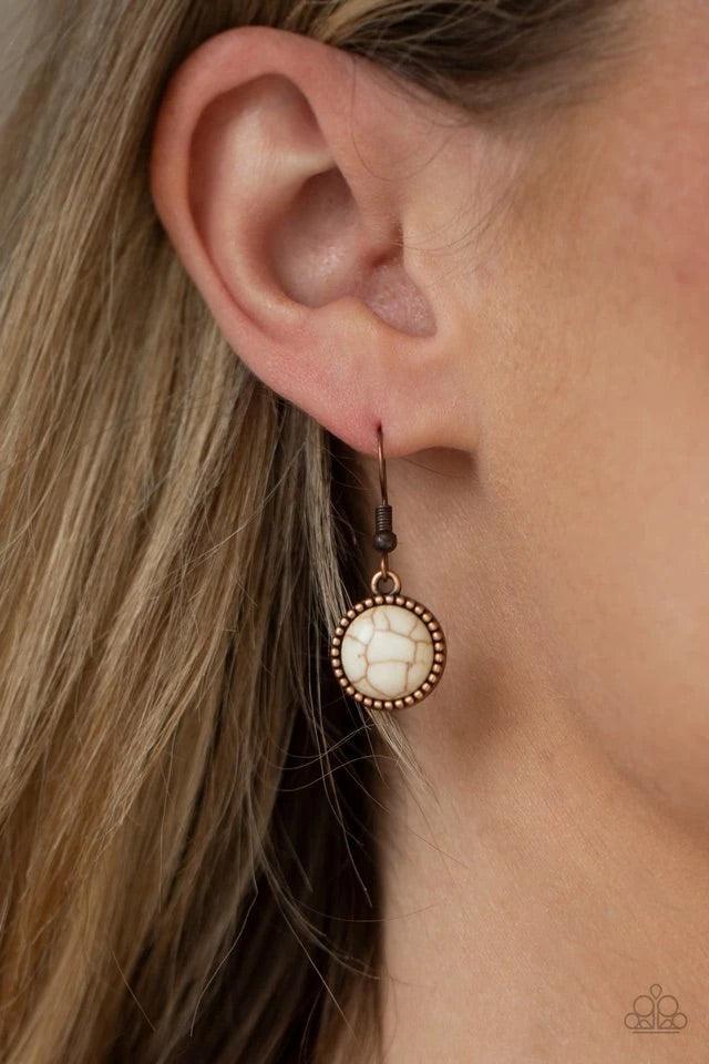 Paparazzi Accessories Terrestrial Trailblazer - Copper Featuring studded and plain copper frames, small and large white stones delicately alternate below the collar. A refreshing white stone teardrop frame swings from the bottom of a matching stone frame,