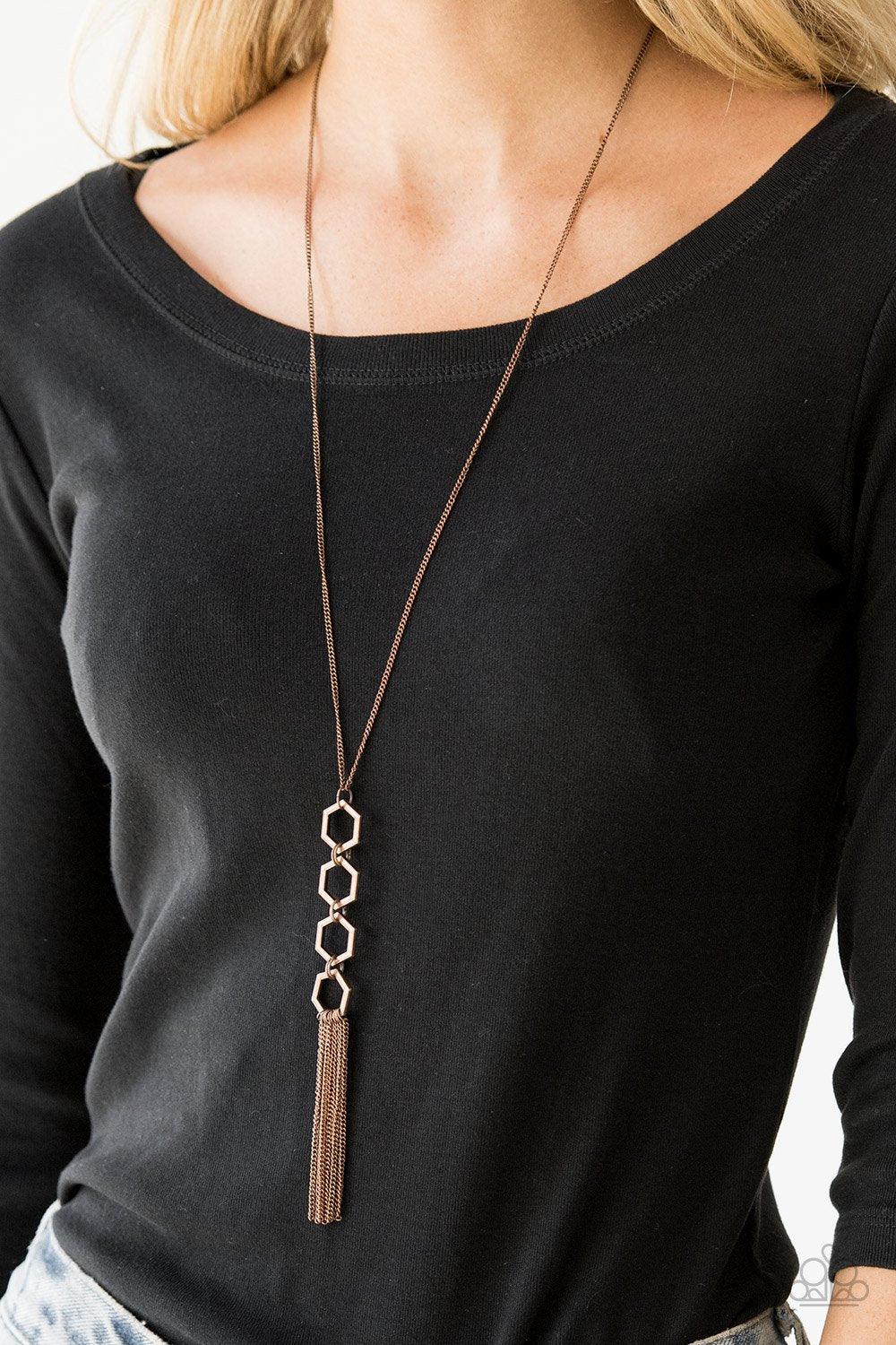 Paparazzi Accessories Ready, Set, GEO! - Copper Four copper hexagon frames connect at the bottom of a lengthened copper chain, creating an edgy stacked pendant. A glistening copper tassel swings from the bottom of the geometric pendant, adding movement to