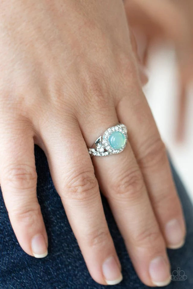 Paparazzi Accessories New Age Nirvana - Green An opal green bead is pressed into the center of a ring of white rhinestones that sits atop interwoven silver bars dotted in dainty white rhinestones, creating an ethereally elegant centerpiece atop the finger