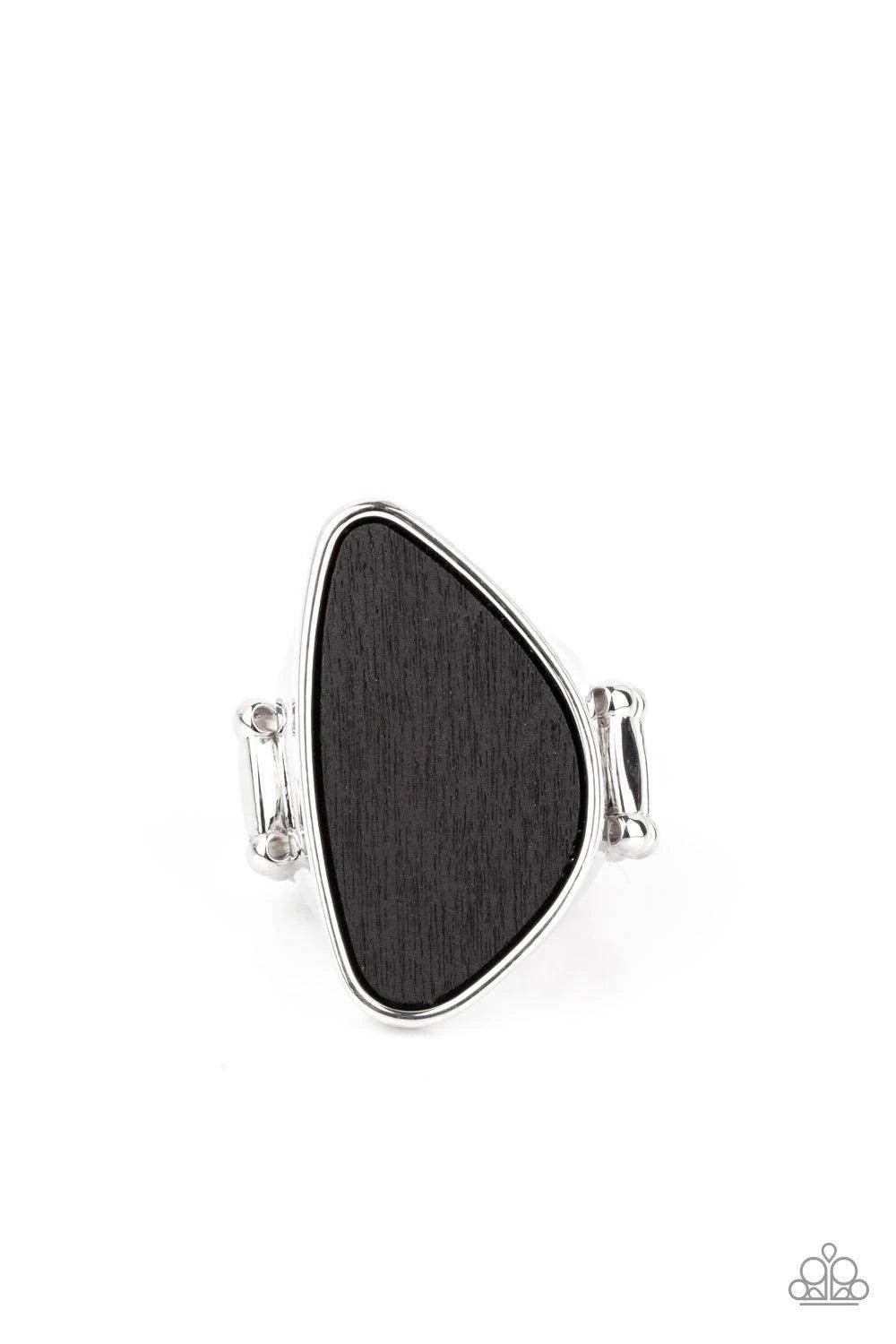 Paparazzi Accessories Perfectly Petrified ~Black Rings an asymmetrical piece of rustic black wood is nestled inside a sleek silver frame that thickens into a shimmery band around the finger, creating a refined centerpiece. Features a stretchy band for a f