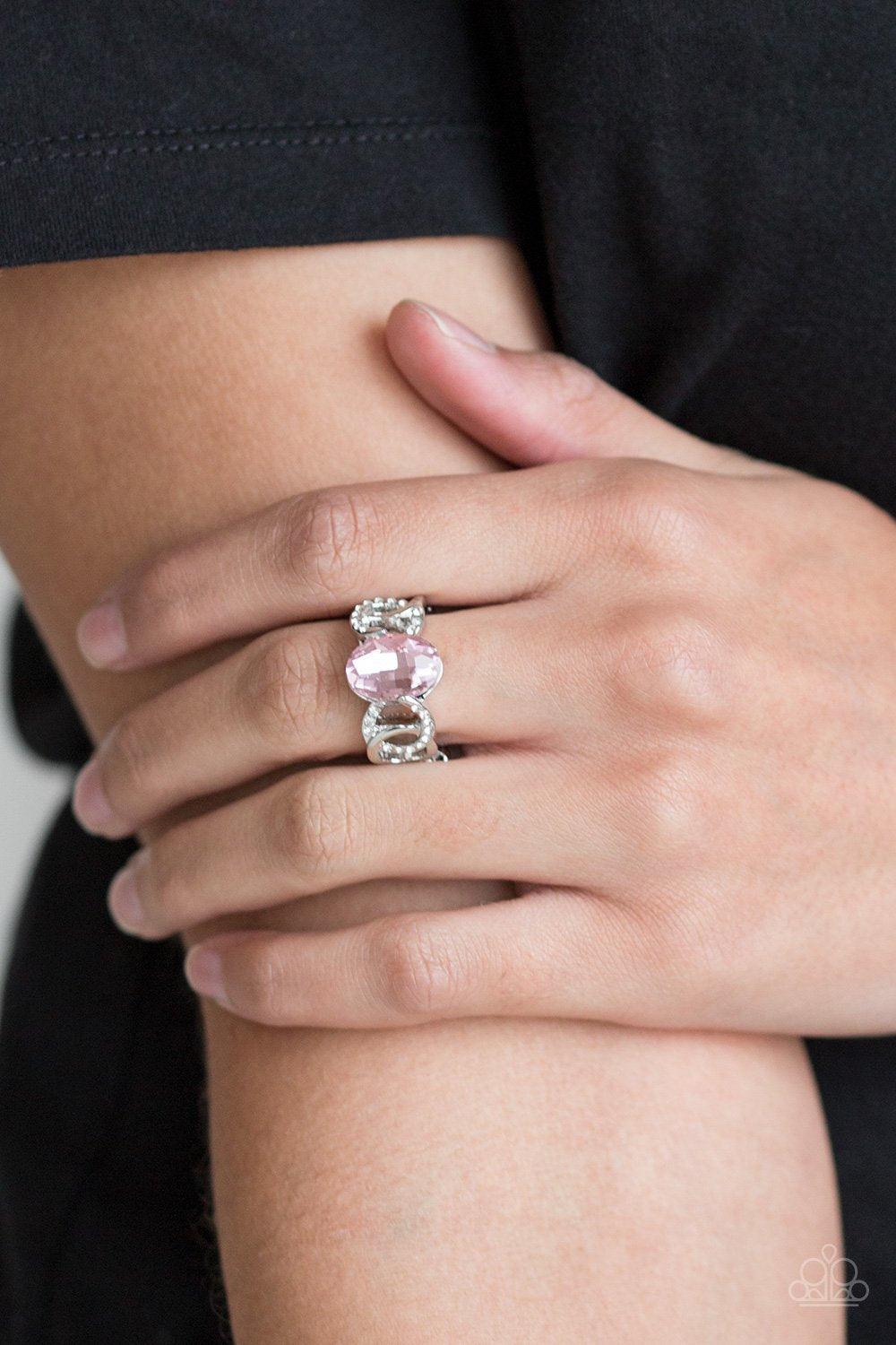 Paparazzi Accessories Supreme Bling - Pink White rhinestone encrusted frames and shiny silver frames link across the finger, coalescing into an airy band. A glittery pink rhinestone is pressed into the center of the band for a glamorous finish. Features a