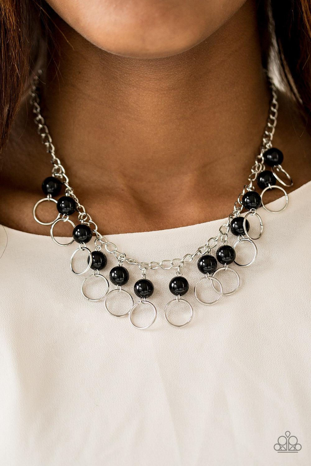 Paparazzi Accessories Run The Show - Black Shiny black beads trickle from the bottom of a glistening silver chain. Shimmery silver hoops cascade from the beads, creating a flirty fringe below the collar. Features an adjustable clasp closure. Sold as one i
