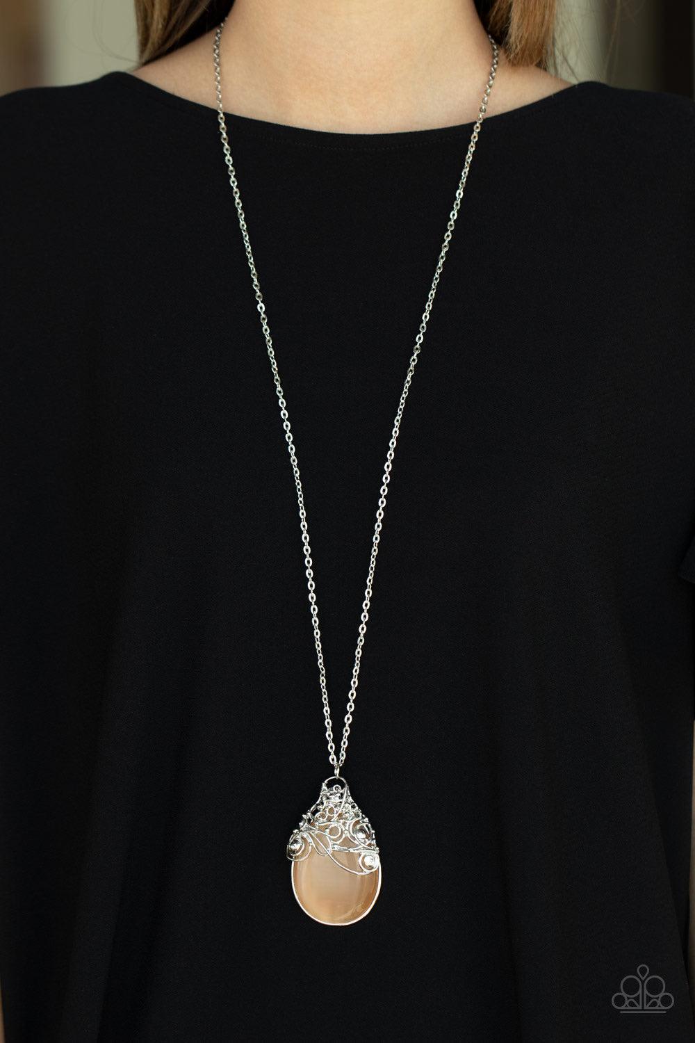 Paparazzi Accessories Tangled Gardens - Orange A collection of whimsically twisted wire delicately overlaps across the top of an oversized orange cat's eye teardrop stone, creating an ethereal pendant at the bottom of a lengthened silver chain. Features a