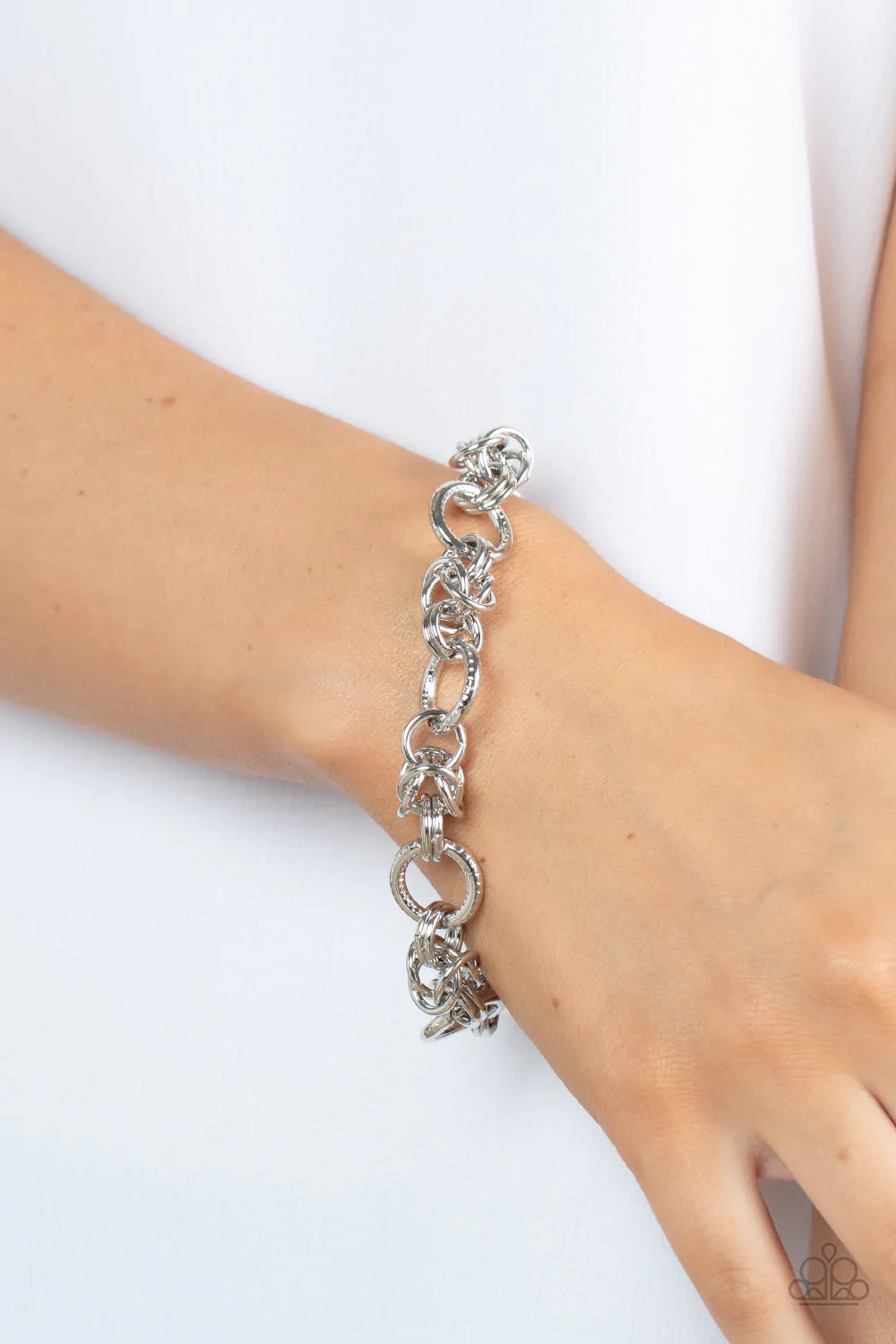 Paparazzi Accessories Big City Chic Gold: Spunky sections of mismatched gold links boldly interlock around the wrist, creating a gritty chain. Features an adjustable clasp closure. Sold as one individual bracelet. Silver: Spunky sections of mismatched sil