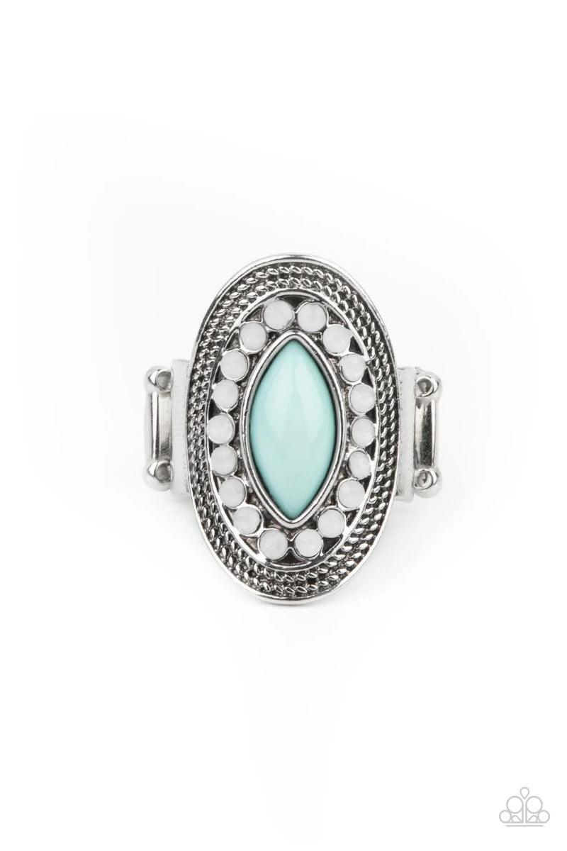 Paparazzi Accessories Tea Light Twinkle - Blue A silver frame embellished with dewy white beads and studded silver texture creates a stunning backdrop for a New Blue marquise cut bead as it sits atop the finger. Features a stretchy band for a flexible fit
