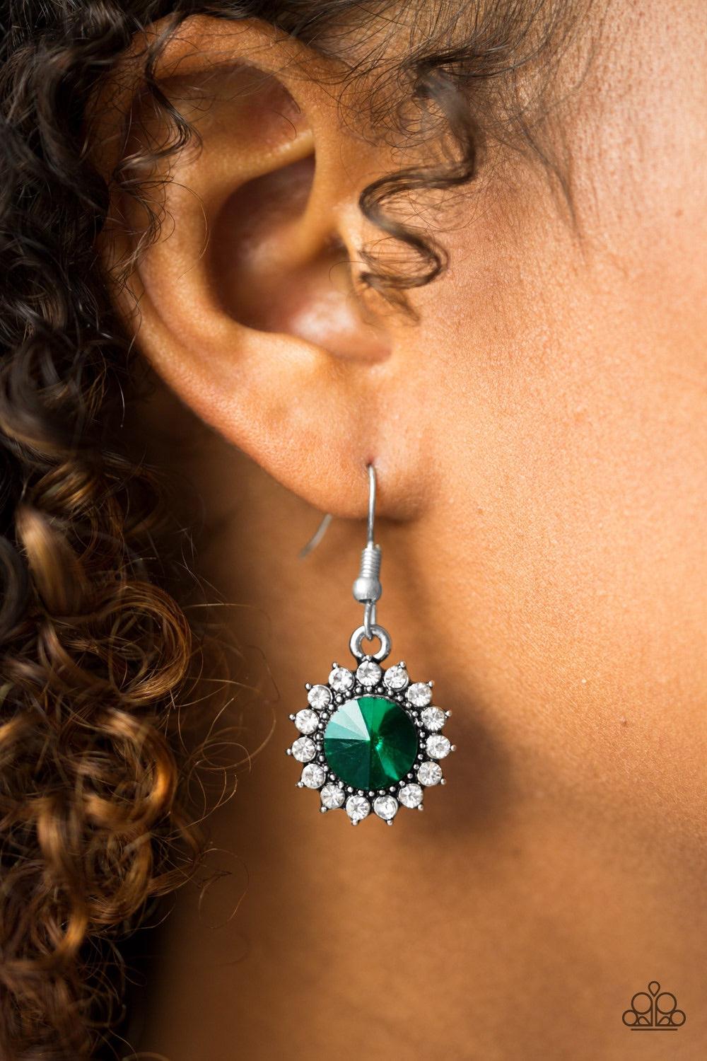Paparazzi Accessories Bring In The BEAM Team - Green A glittery green rhinestone is pressed into a silver frame radiating with dainty white rhinestones for a glamorous look. Earring attaches to a standard fishhook fitting. Jewelry