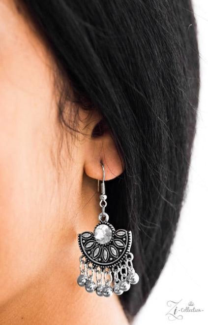 Paparazzi Accessories Legend Three oversized crescent plates connect vertically down the chest, creating a dramatically stacked pendant. Infused with shimmery tribal patterns and layers of flirty beaded fringe, glittery white rhinestones are haphazardly p