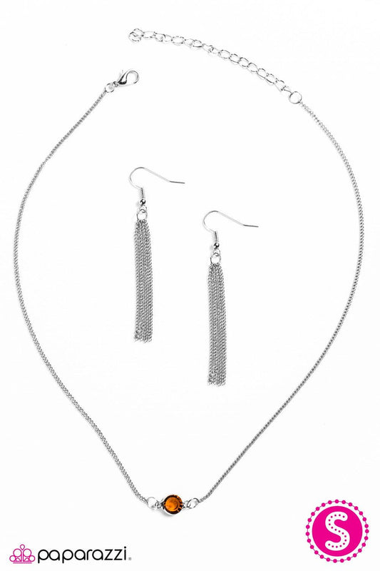 Paparazzi Accessories Stay Glassy -Brown A sparkling brown gem is nestled inside a classic silver frame, creating a simple, yet colorful pendant. Features an adjustable clasp closure. Necklaces