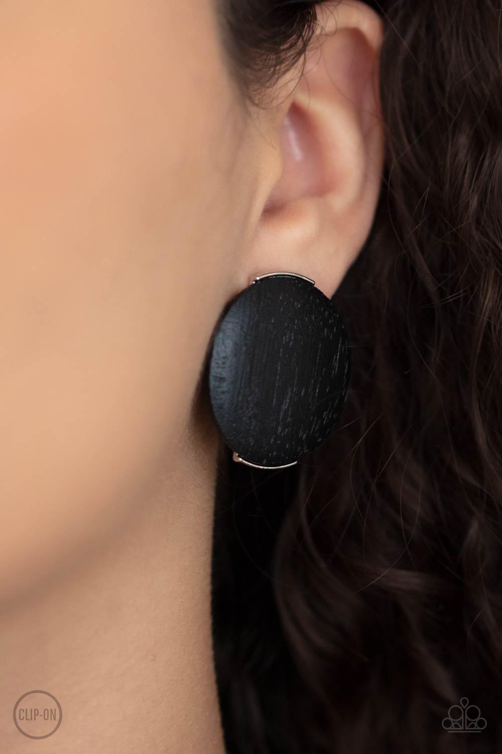 Paparazzi Accessories WOODWORK It - Black. *Clip-On An oversized black wooden disc is fitting in place between a silver frame, creating an earthy effect. Earring attaches to a standard clip-on fitting. Sold as one pair of clip-on earrings. Jewelry