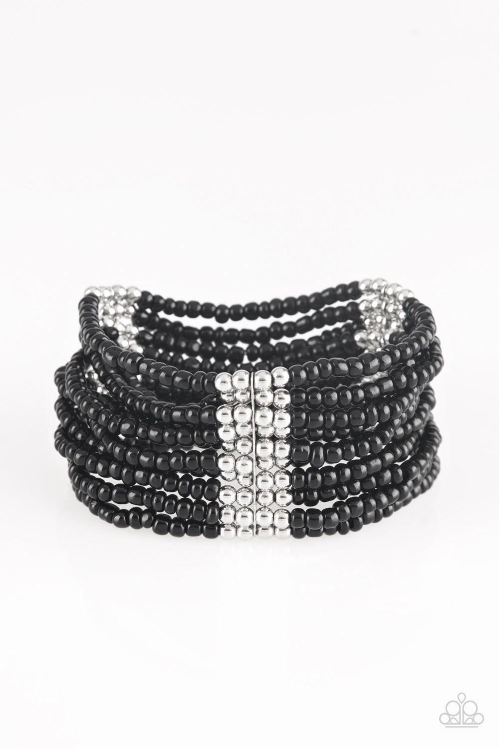 Paparazzi Accessories Outback Odyssey - Black Joined together with metallic fittings, countless black seed beads are threaded along stretchy elastic bands. Sections of dainty silver beads are sprinkled along the colorful layers, adding hints of shimmer to