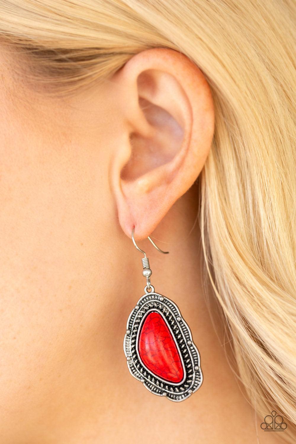 Paparazzi Accessories Santa Fe Soul - Red A fiery red stone is pressed into an ornate silver frame radiating with studded and serrated textures for a seasonal look. Earring attaches to a standard fishhook fitting. Jewelry
