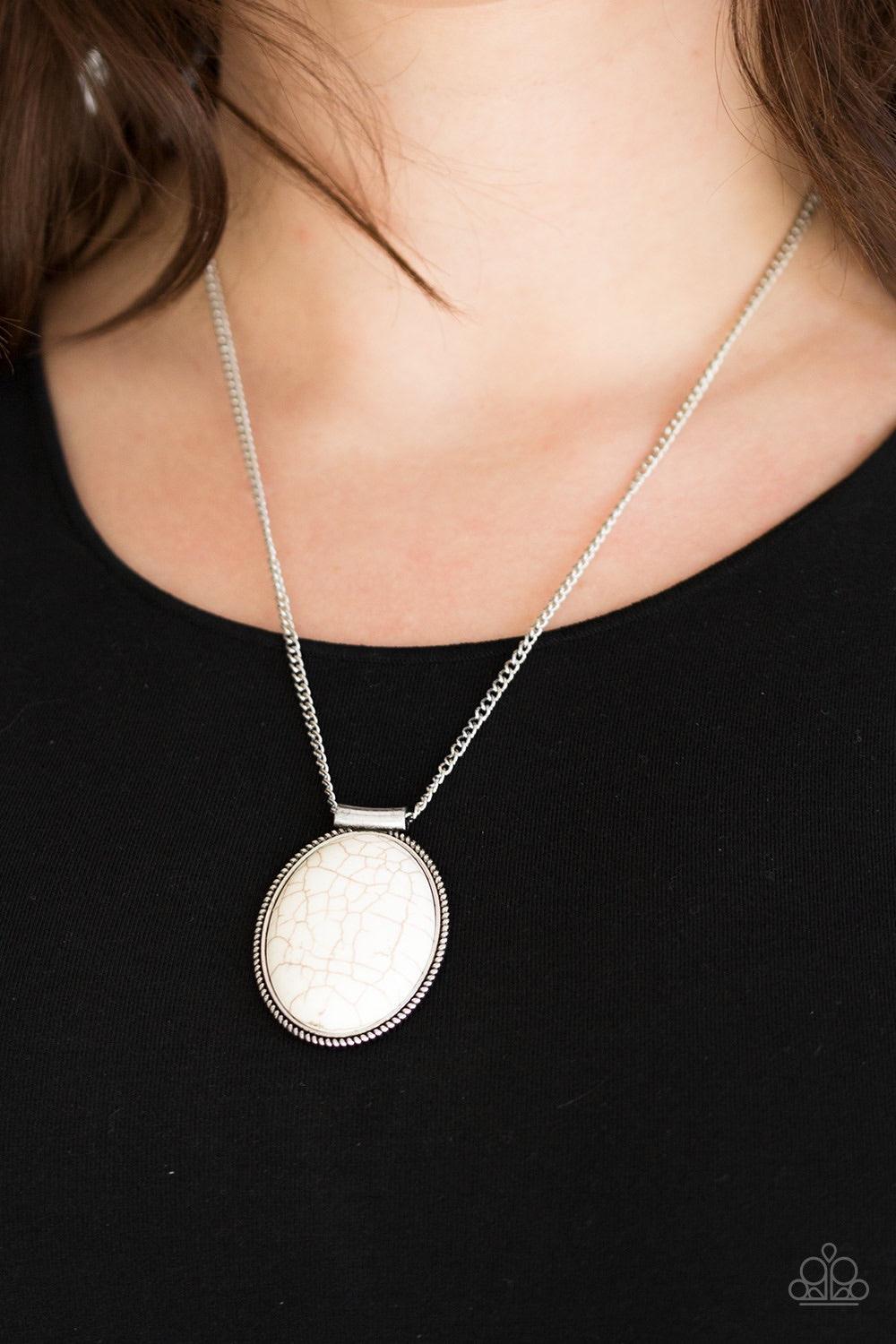 Paparazzi Accessories Southwest Showdown - White A smooth white stone is pressed into a textured silver frame, creating a bold seasonal pendant below the collar. Features an adjustable clasp closure Jewelry