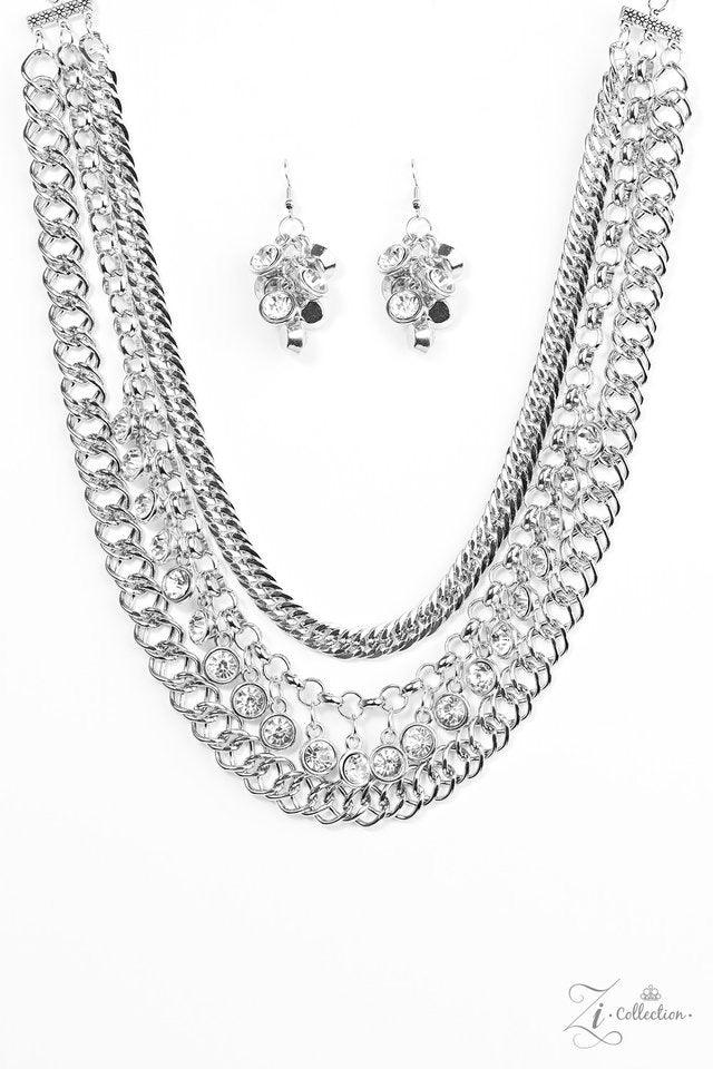 Paparazzi Accessories Powerhouse A row of white rhinestones drip between two rows of bulky silver chains, creating hypnotizing layers. Brushed in a blinding shimmer, the dramatic rows of chain and gems create the ultimate sparkle below the collar. Feature