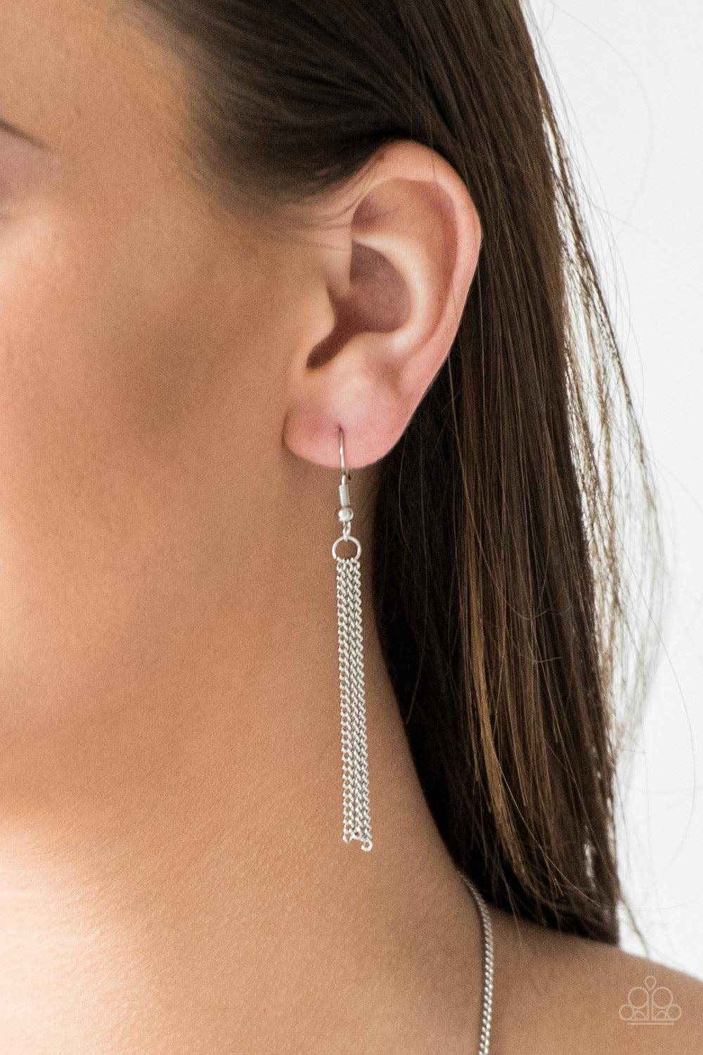 Paparazzi Accessories Tiki Tease - Red Brushed in a fiery red finish, a bubbly silver teardrop swings from the bottom of an elongated silver chain for a tribal inspired look. Features an adjustable clasp closure. Jewelry