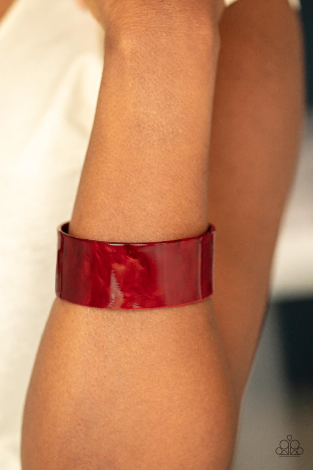 Paparazzi Accessories Glaze Over - Red Glazed in shimmer, a red acrylic cuff curls across the wrist for a colorfully retro look. Jewelry