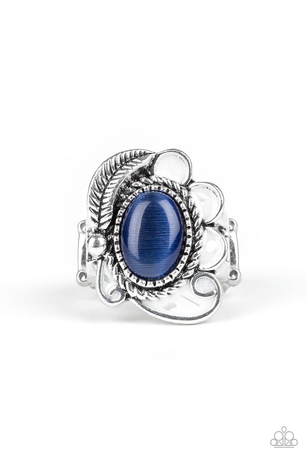 Paparazzi Accessories Fairytale Magic - Blue A glowing blue cat's eye stone is pressed into the center of a shimmery silver frame radiating with a silver feather and glistening white petals, creating a whimsical compilation atop the finger. Features a str