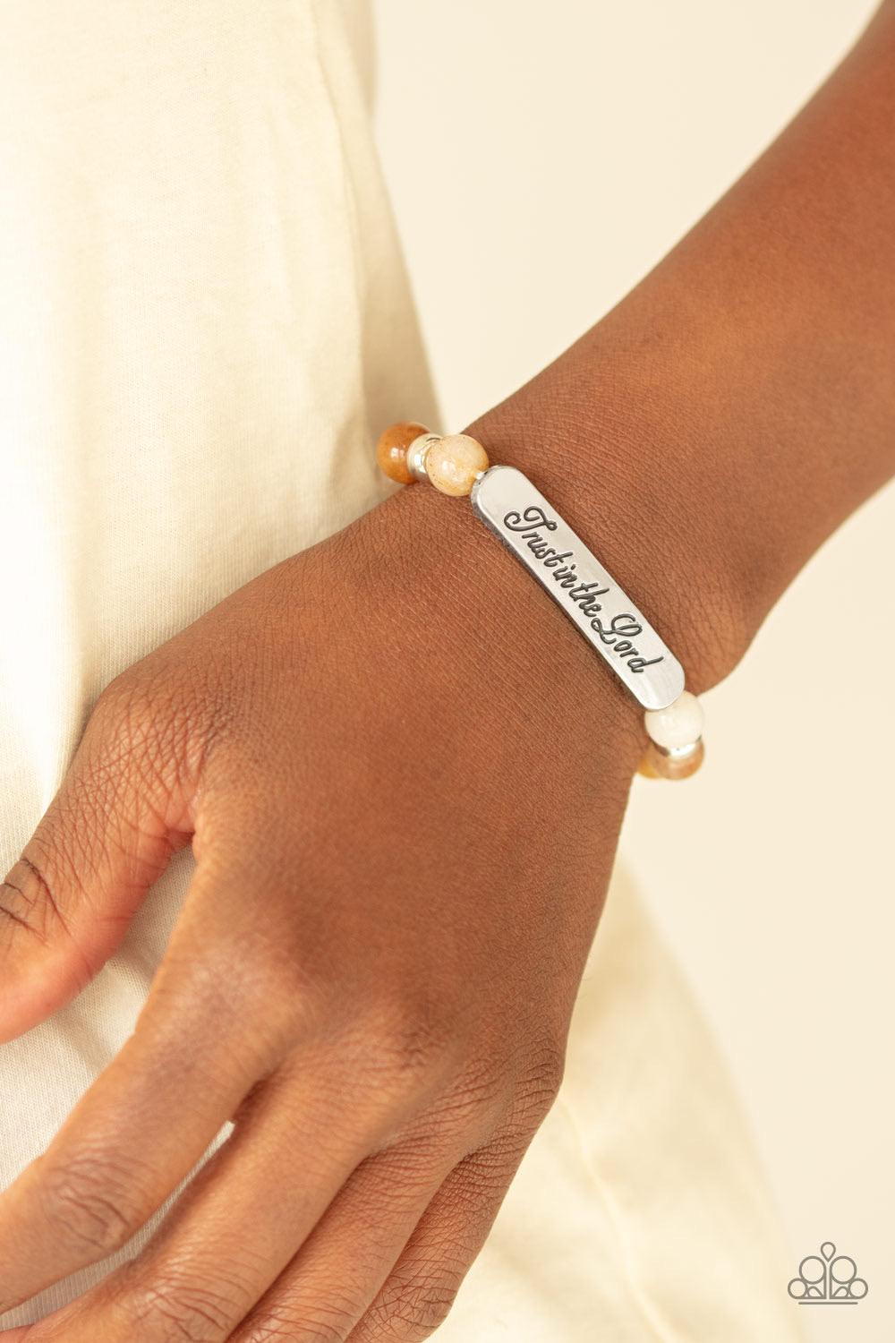 Paparazzi Accessories Keep The Trust - Multi Infused with dainty silver accents, a collection of glassy stone beads and a shimmery silver frame stamped in the phrase, "Trust in the Lord", are threaded along a stretchy band around the wrist for an inspirat