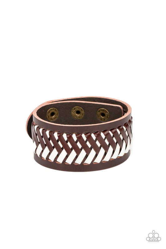 Paparazzi Accessories Punk Rocker Road - Brown Brown and white leather laces decoratively crisscross across the front of a thick brown leather band, resulting in a rebellious pop of color around the wrist. Features an adjustable snap closure. Sold as one