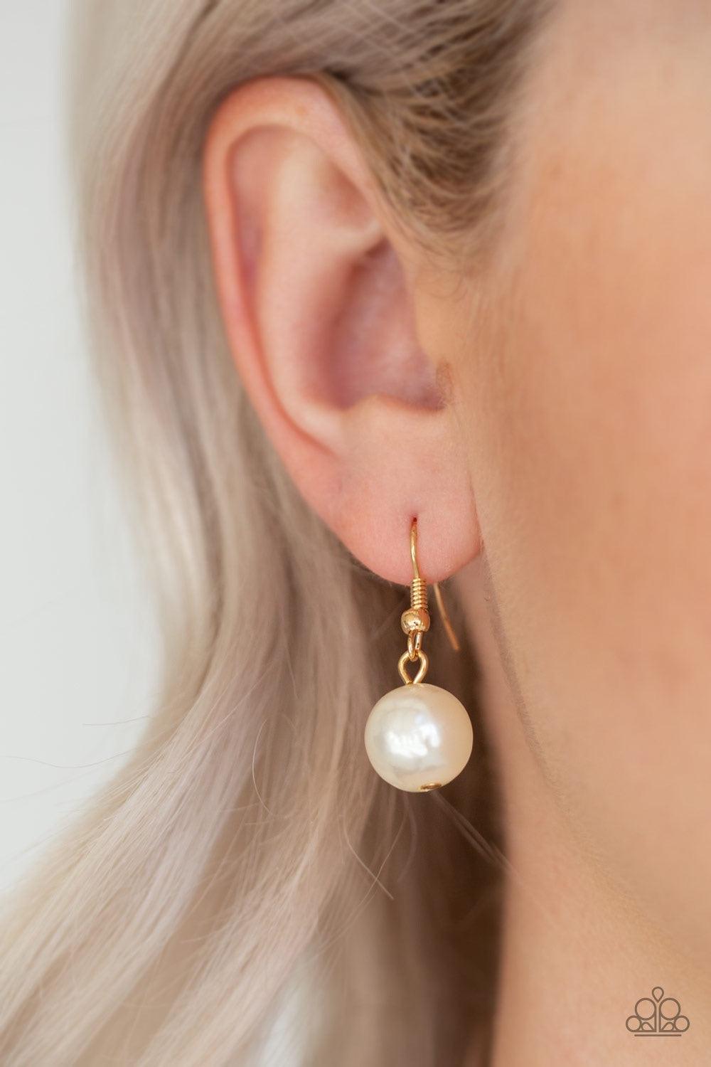 Paparazzi Accessories Endless Elegance - Gold A dramatic gold chain gives way to two strands of pearly white beads. Infused with matching pearl fittings and dainty gold accents, the beaded strand drapes down the chest in a refined fashion. Features an adj