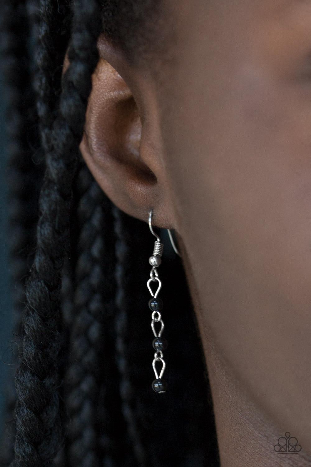 Paparazzi Accessories Harlem Hideaway - Black Infused with black beaded tassels, shimmery silver chains stream below the collar, creating a colorful fringe. Features an adjustable clasp closure. Jewelry