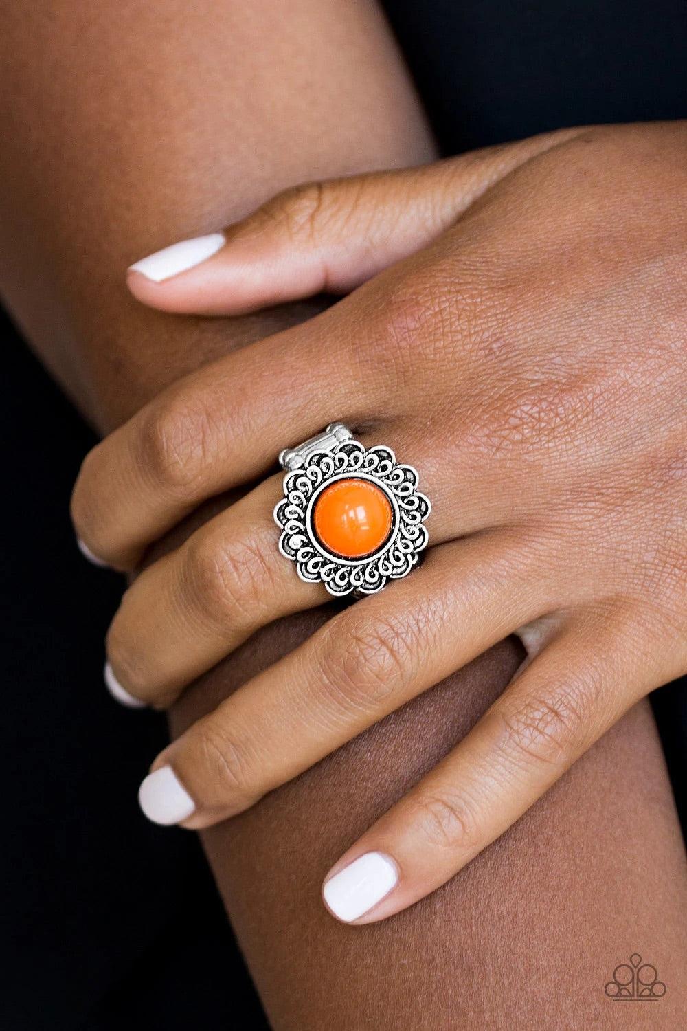 Paparazzi Accessories Garden Stroll - Orange A vivacious orange bead is pressed into the center of a shimmery floral frame radiating with swirling detail. Features a stretchy band for a flexible fit. Sold as one individual ring. Jewelry