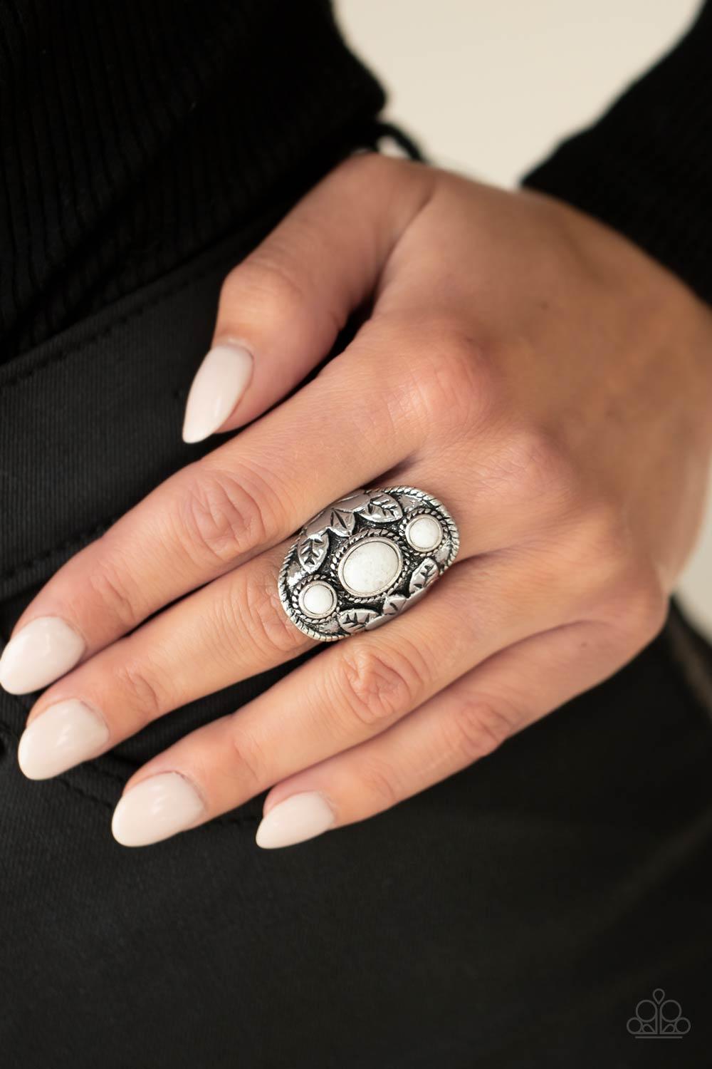 Paparazzi Accessories PALMS Up - White Embossed in whimsical palm leaf patterns, a rustic silver frame is dotted in white quartz stones for a mystical finish. Features a stretchy band for a flexible fit. Jewelry