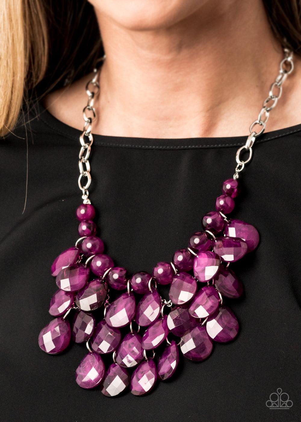 Paparazzi Accessories Sorry To Burst Your Bubble - Purple Attached to a bold silver chain, round opaque plum beads are threaded along an invisible wire below the collar. Attached to a net of silver chains, faceted opaque teardrops cascade from the bottom