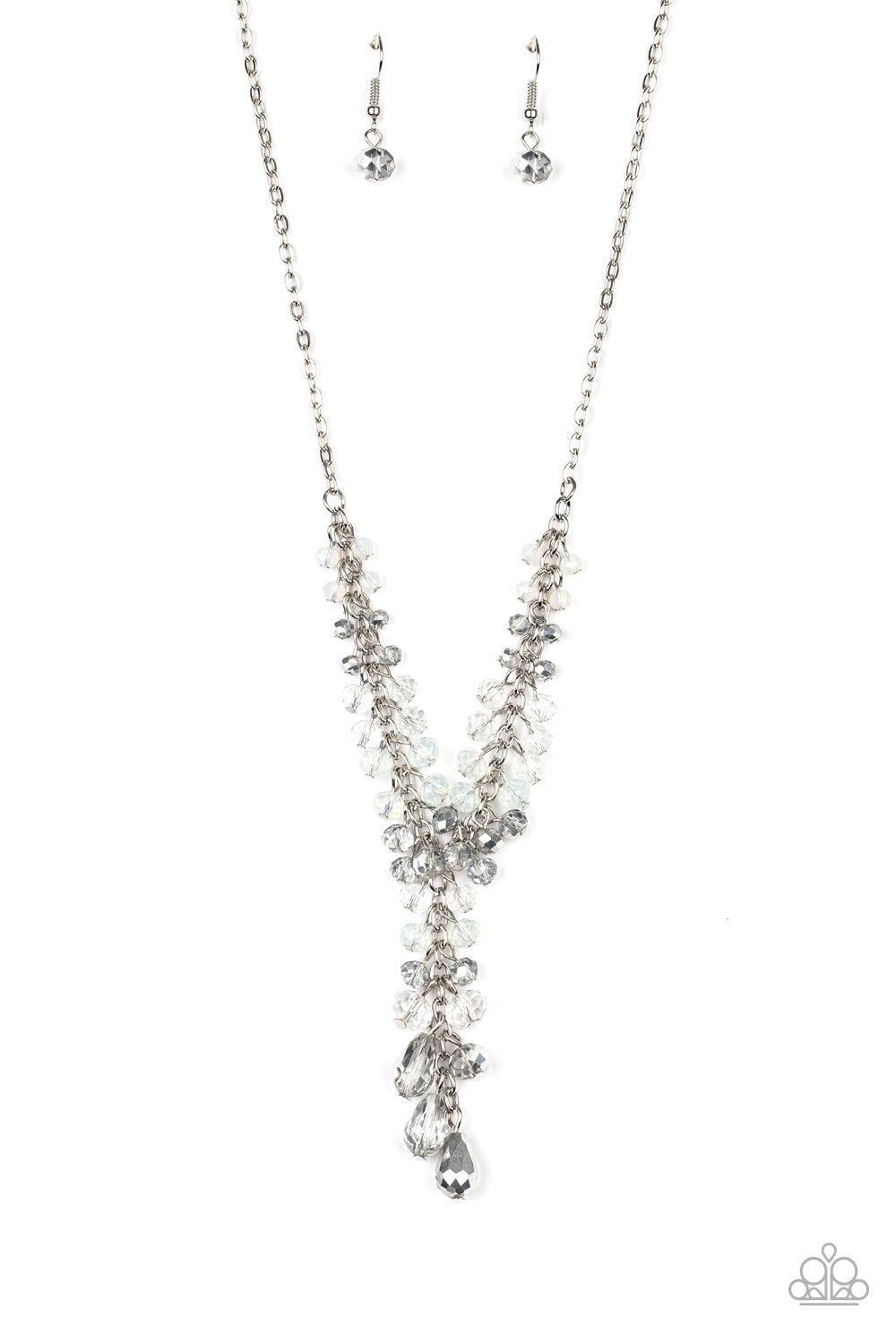 Paparazzi Accessories Iridescent Illumination - Silver A fringe of white, opaque, and metallic flecked crystal-like beads dangle from the bottom of a shimmery silver chain. Matching round and teardrop beads cascade from an extended silver chain at the cen