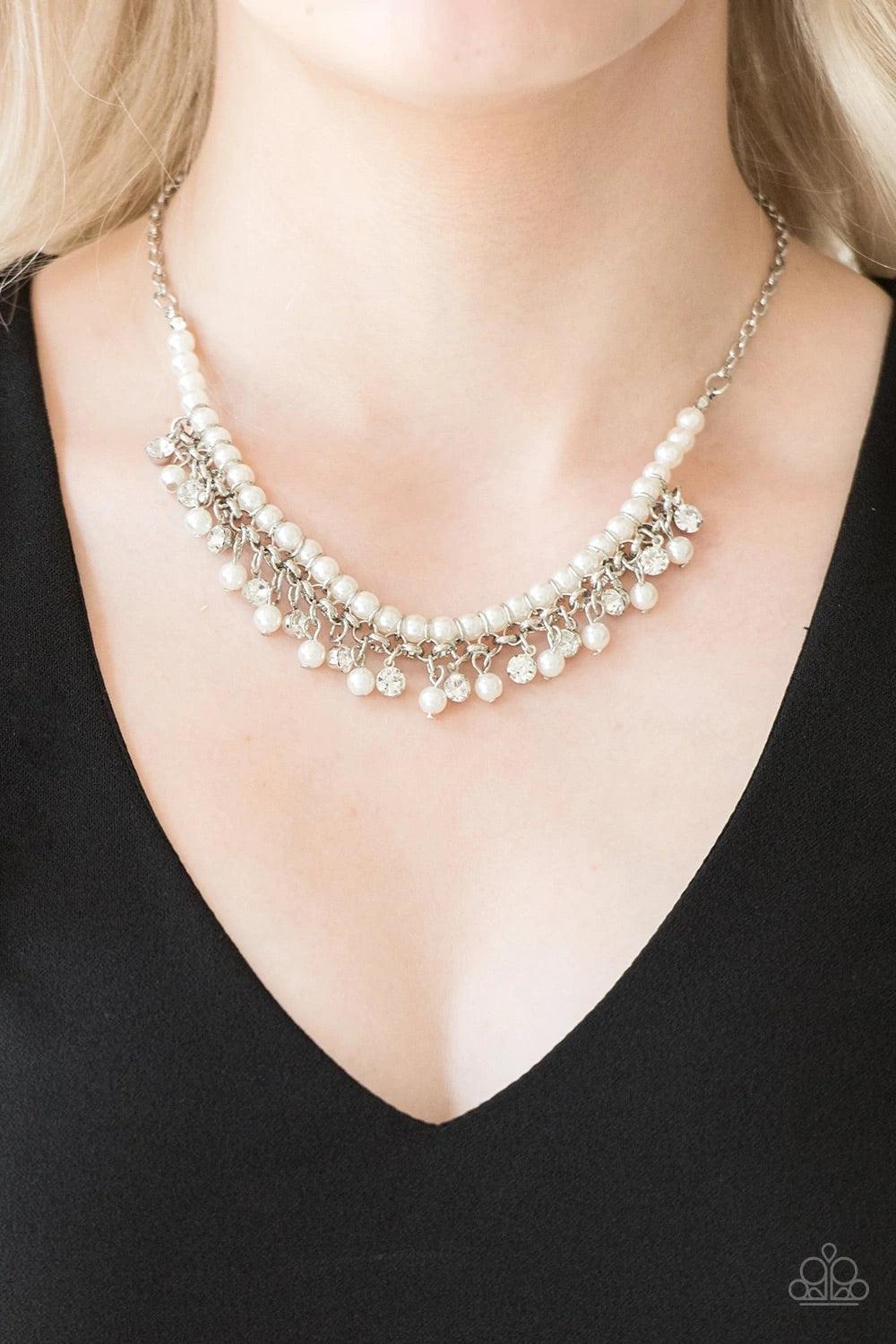 Paparazzi Accessories A Touch of Classy - White Infused with silver chain, classic white pearls are threaded along an invisible wire below the collar. Matching white pearls and glittery white rhinestones swing from the pearly strand, creating a flirtatiou