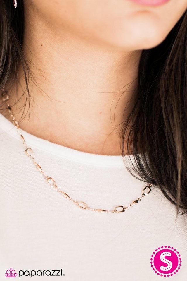 Paparazzi Accessories SQUARE She Goes Again - Rose Gold Square frames join shimmery rose gold accents below the collar, creating a gorgeous geometric palette. Features an adjustable clasp closure. Jewelry