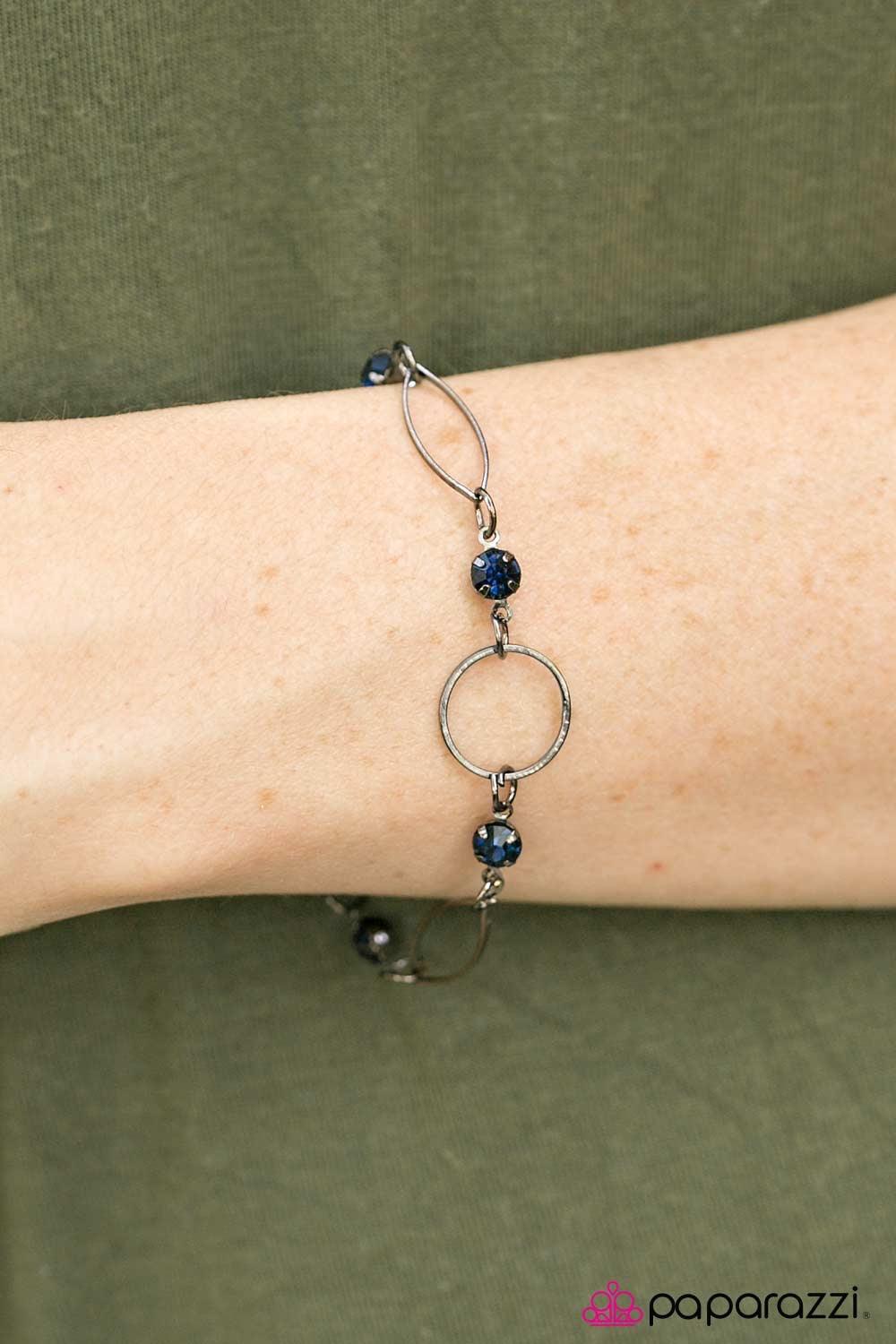 Paparazzi Accessories More Glitter - Blue Elegant marquise shaped frames join classic gunmetal hoops around the wrist. Glittery blue rhinestones trickle between the joined frames, adding a refined sparkle to the timeless palette. Features an adjustable cl