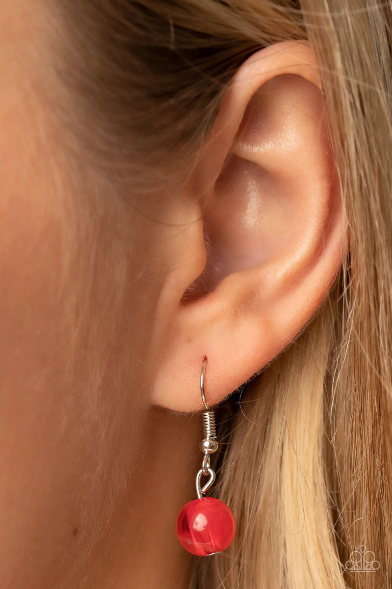 Paparazzi Accessories Horseshoe Bend - Red Flat silver beads fade into cloudy red stone beads as they bow into a half moon at the bottom of a curved silver bar, creating an ethereal pop of color at the bottom of an extended silver chain. Features an adjus