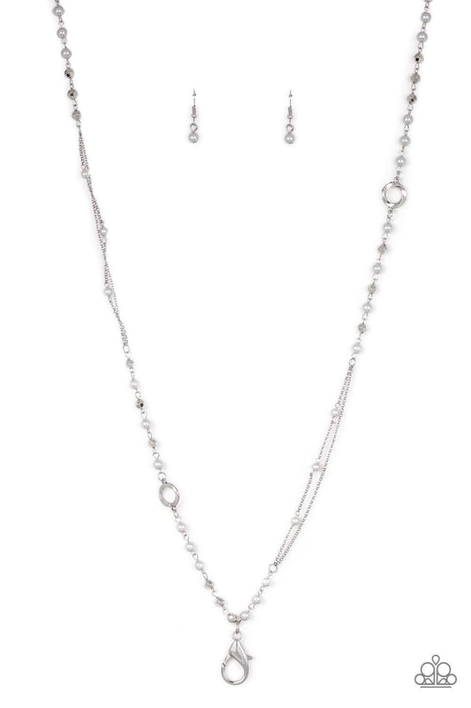 Paparazzi Accessories Really Refined - Silver *Lanyard A collection of pearly silver, twisting silver hoops, and faceted silver beads trickle along an asymmetrical silver chain for a refined look. A lobster clasp hangs from the bottom of the design to all