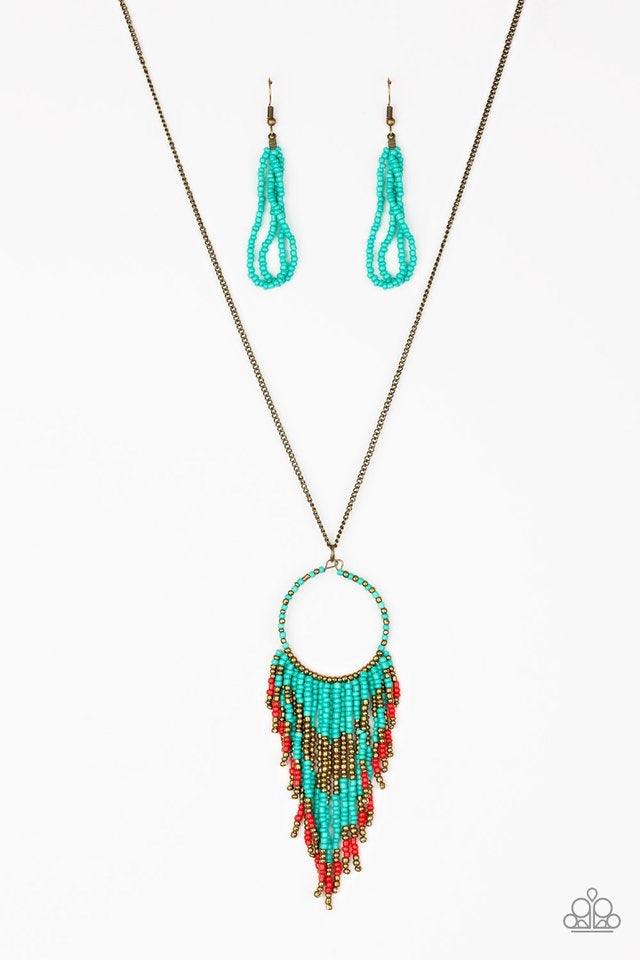 Paparazzi Accessories Badlands Beauty - Blue Infused with blue, brass, and red seed beads, a colorful dream catcher like pendant swings from the bottom of a lengthened brass chain for a tribal inspired look. Features an adjustable clasp closure. Jewelry
