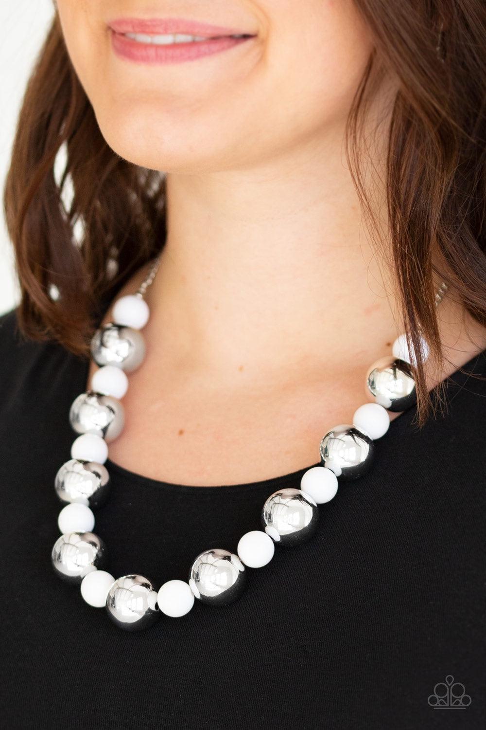 Paparazzi Accessories Top Pop - White Polished white beads and dramatic silver beads drape below the collar for a perfect pop of color. Features an adjustable clasp closure. Jewelry